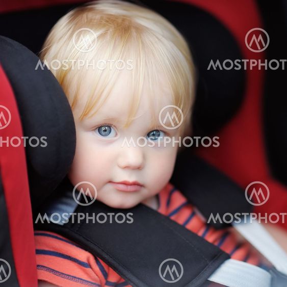 Toddler boy in car seat