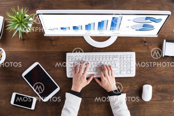 Businessperson Analyzing Graph On Computer