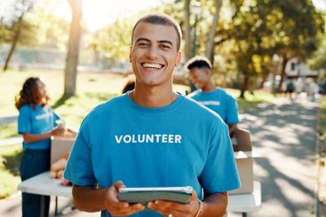 Outdoor, man and portrait of volunteer with tablet for...