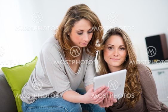 portrait of two beautiful girls at home