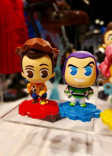 Cute model figures of Buzz Lightyear and Sheriff Woody. 