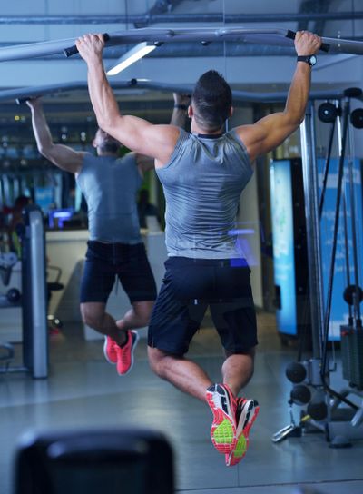 handsome man exercising at the gym