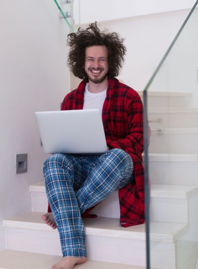 freelancer in bathrobe working from home