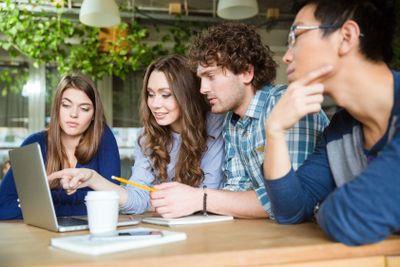 Group of business partners discussing new project in office