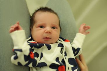 Adorable child newborn baby looking at camera....