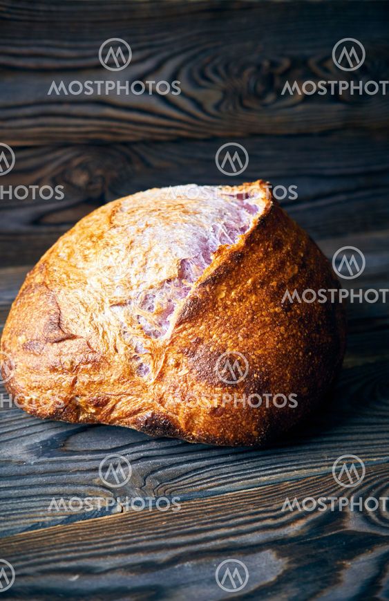 Homemade tartine bread on dark wooden table