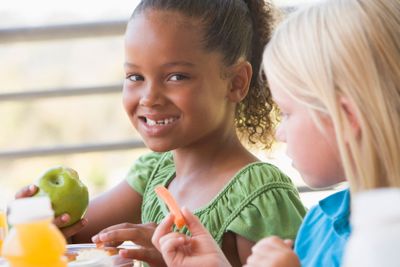Kindergarten children eating lunch