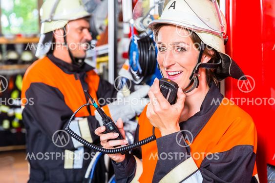 Chief fire fighter checking radio set