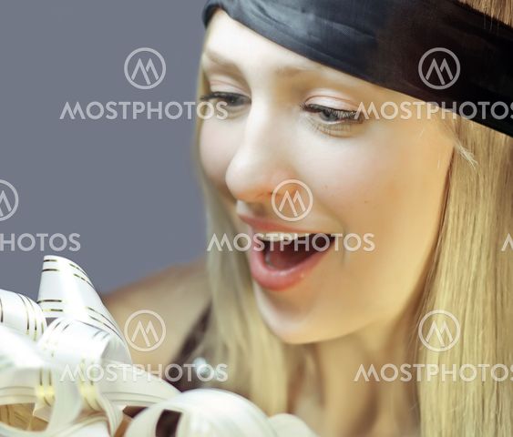 Closeup happy woman face with removed blindfold