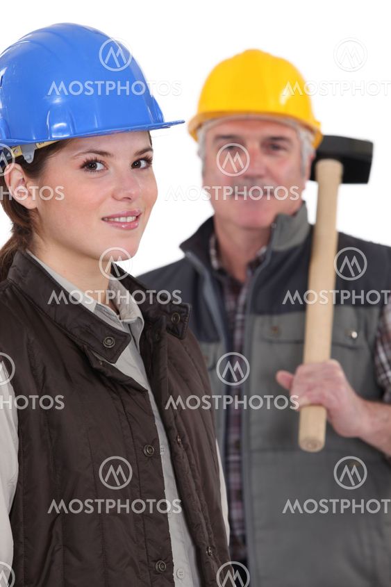 A construction worker and his apprentice.