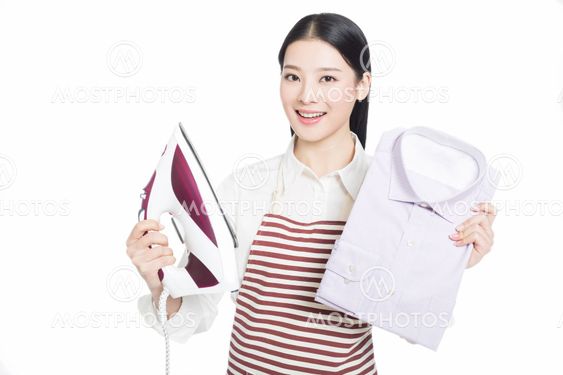 young housewife ironing