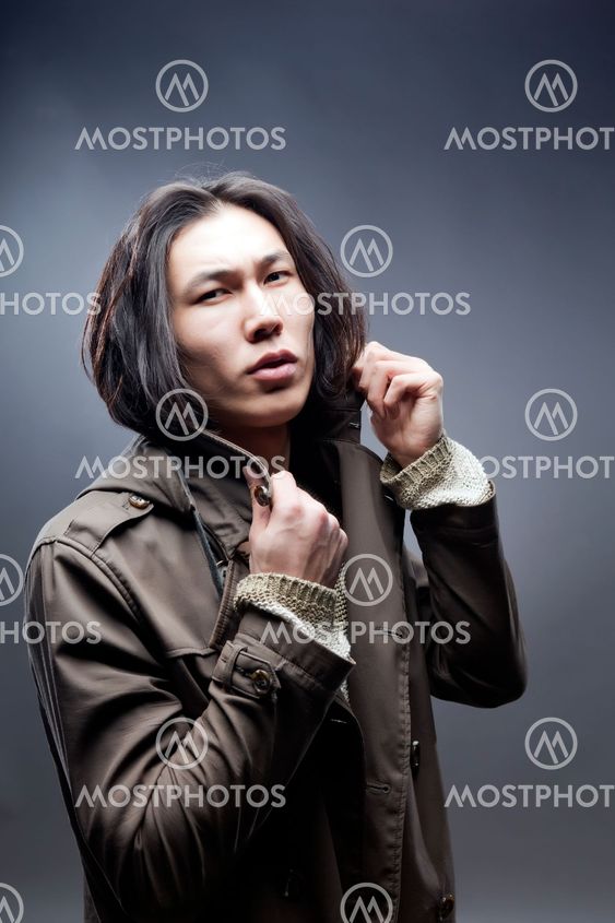 young man in casual clothing raincoat