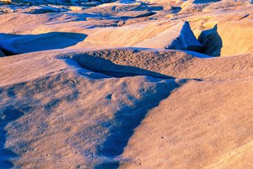 Rolling bedrock on a rocky coast with beautiful evening...