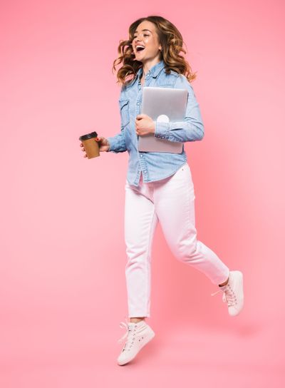 Full length image of Happy woman wearing in denim shirt