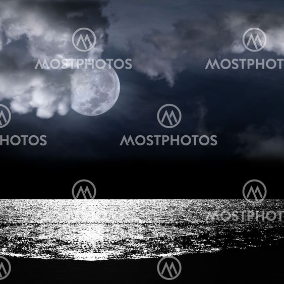 Beautiful full moon behind cloudy