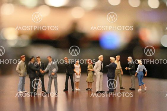 the small figures of business meeting event