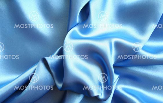 Smooth elegant blue silk as background