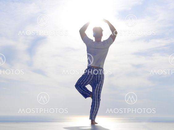 young man practicing yoga