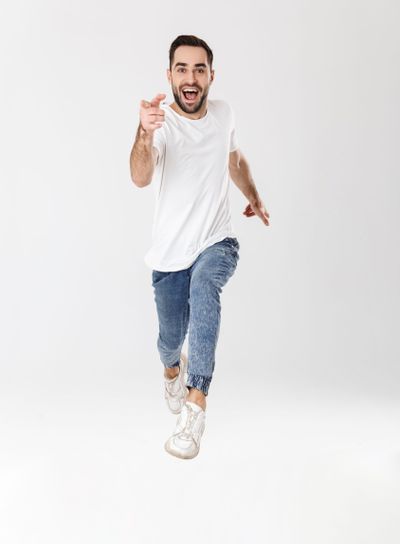 Full length of a handsome cheerful man