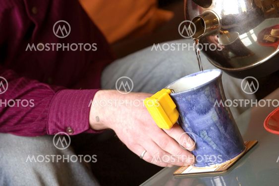 Tea being poured into Cup