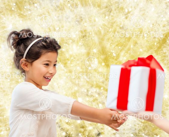 smiling little girl with gift box