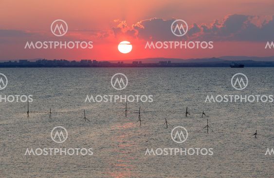 Sea sunset coast view with sun.