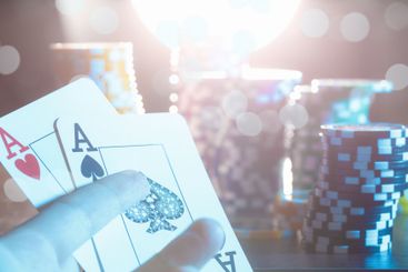 Poker game set of cards and chips close up
