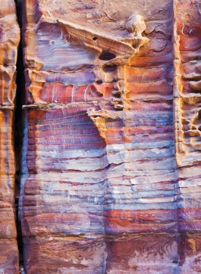 unfinished tomb in multicolour sandrock of Petra
