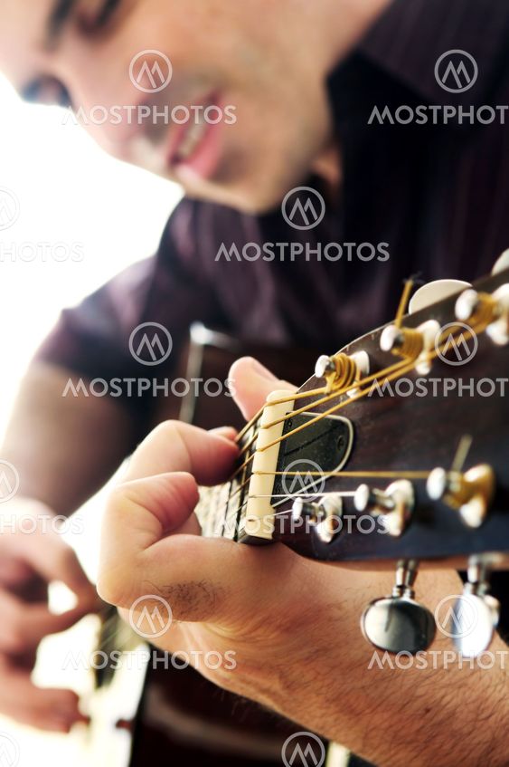 Man playing a guitar