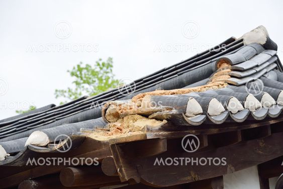 detail of damaged korean traditional tiled roof