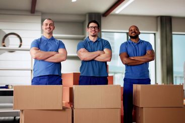 Diverse Team of Professional Movers Relocating a Family