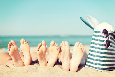 three women lying on the beach