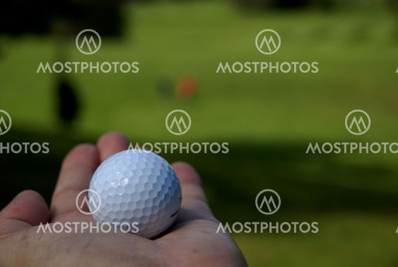 A hand with a golf ball 1