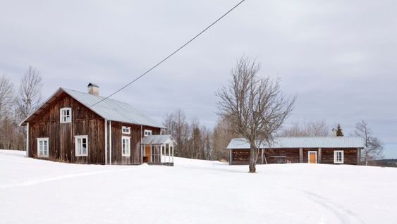 Some wooden building in rural country.