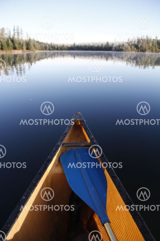 Canoe on smooth lake