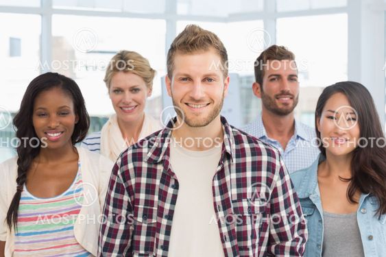 Diverse design team standing and smiling at camera