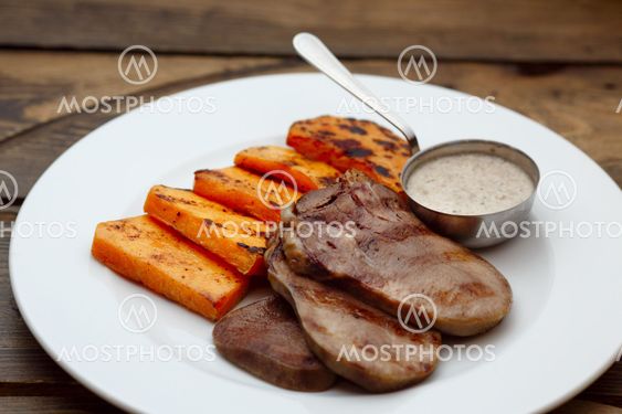 Meat tongue with sauce and pumpkin