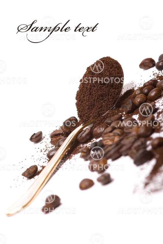 Coffee beans and cocoa in spoon