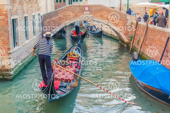 People in Venice gondolas
