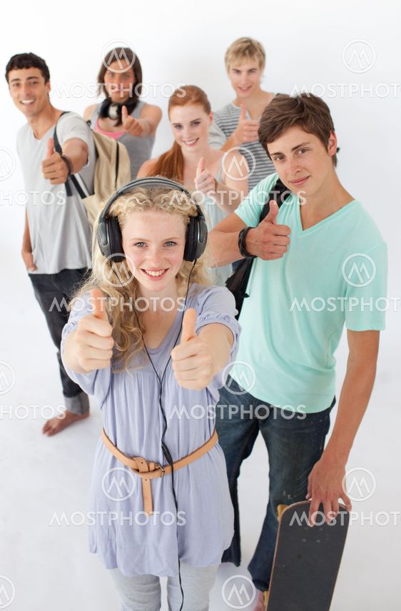 Happy teenagers smiling at the camera