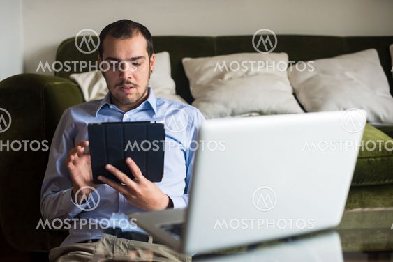 elegant business multitasking multimedia man at home