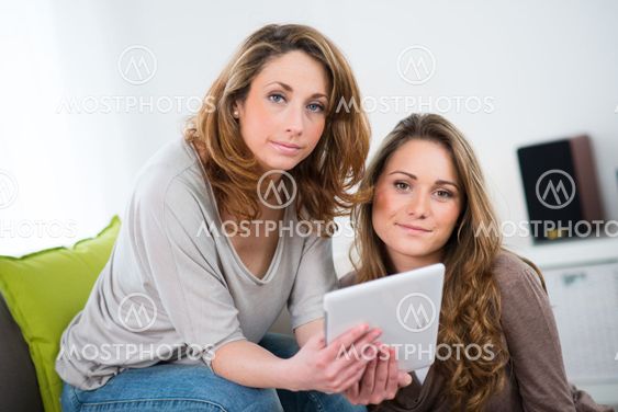 portrait of two beautiful girls at home