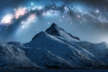 Milky Way and beautiful snowy mountain at winter starry...