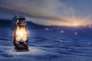 Old traditional lantern on the snow