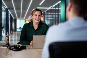 Female Lawyer And Her Client Discussing Divorce Proceedings