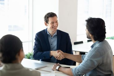 Positive successful Caucasian business leader man giving...