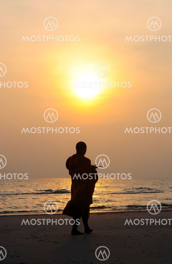 monk on the beach morning