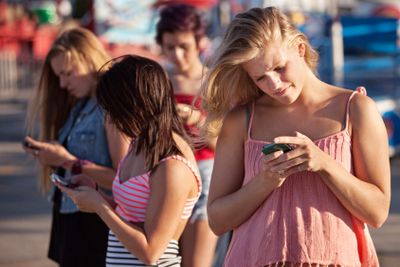 Serious Teenagers on Smartphones