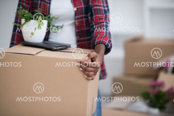 Black girl moving in the new apartment