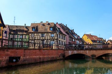 Traditional colourful half-timbered houses alongside the...